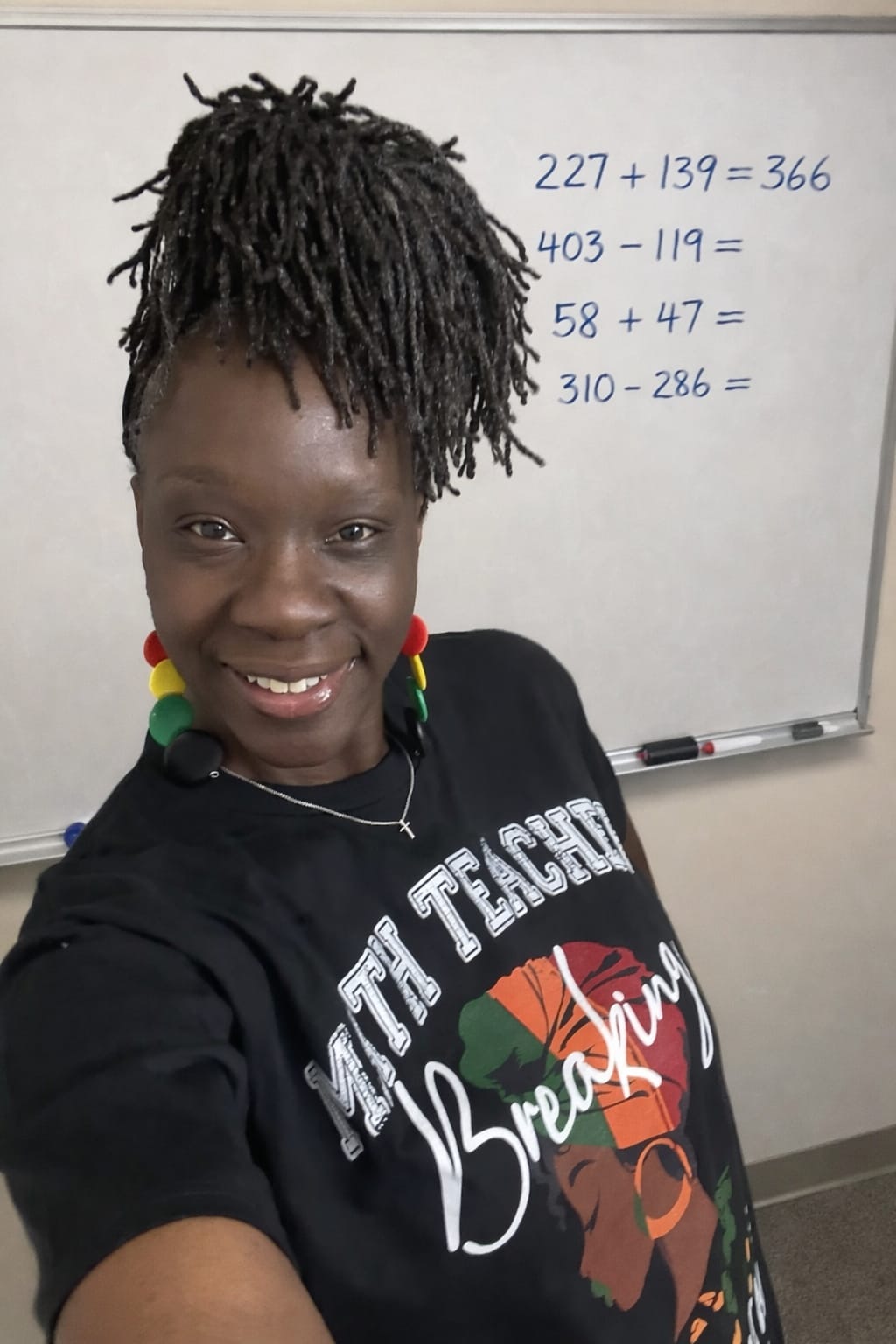 Teacher helping students